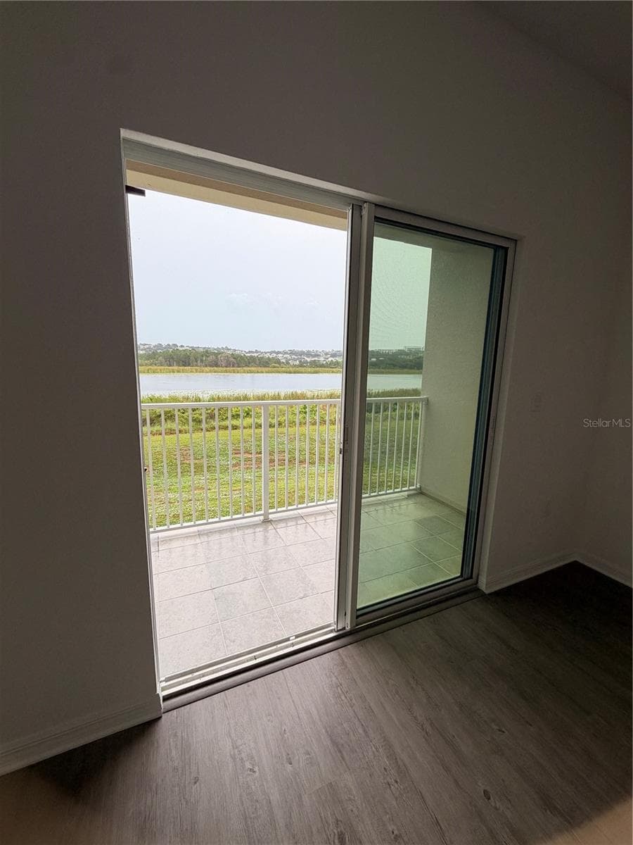 Balcony/ View from living area - 915 LAKEFRONT VILLAGE DR, CLERMONT
