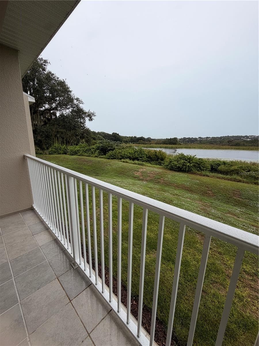 Left side Lake view from balcony - 915 LAKEFRONT VILLAGE DR, CLERMONT