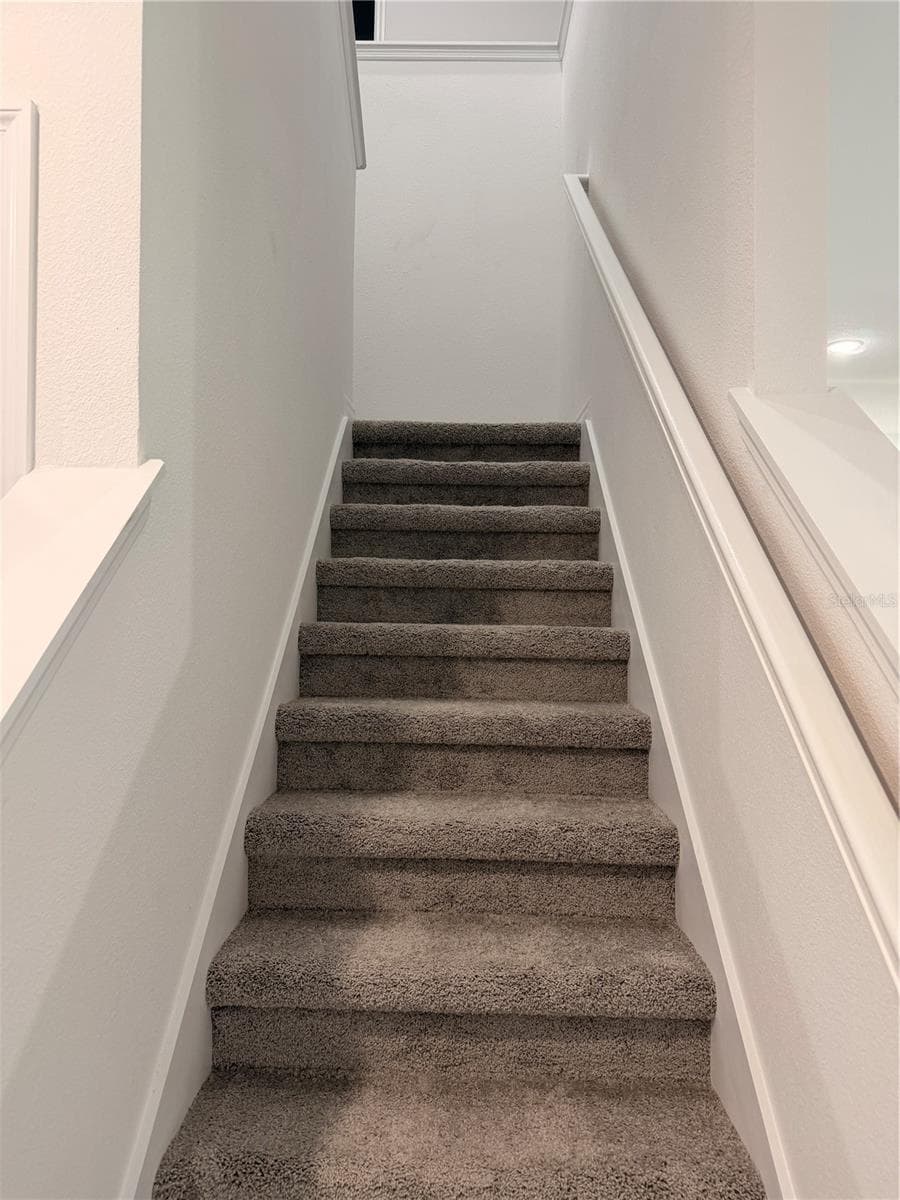 Stairs to second floor - 915 LAKEFRONT VILLAGE DR, CLERMONT