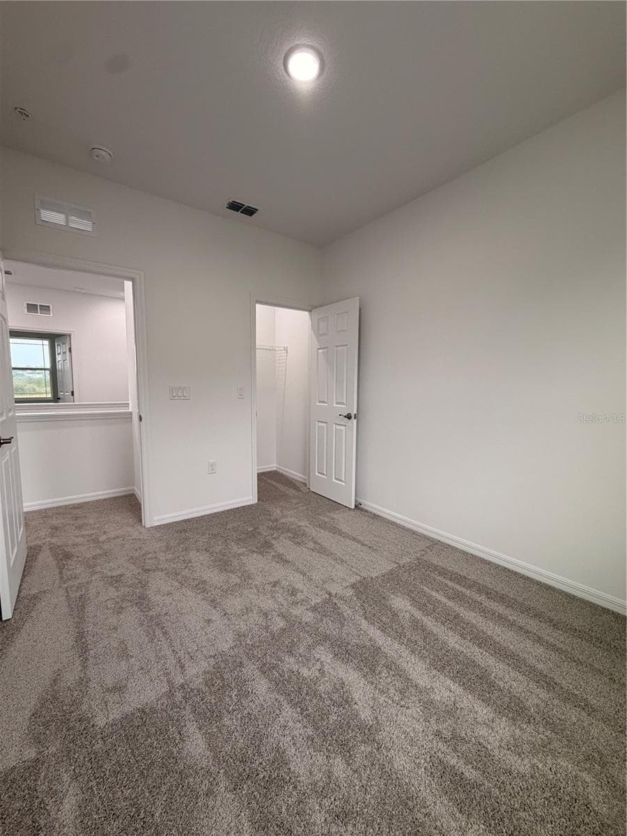 2nd bedroom with closet - 915 LAKEFRONT VILLAGE DR, CLERMONT