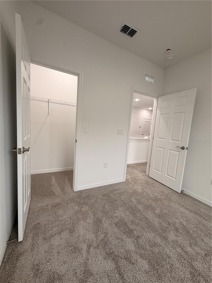 3rd bedroom with closet - 915 LAKEFRONT VILLAGE DR, CLERMONT