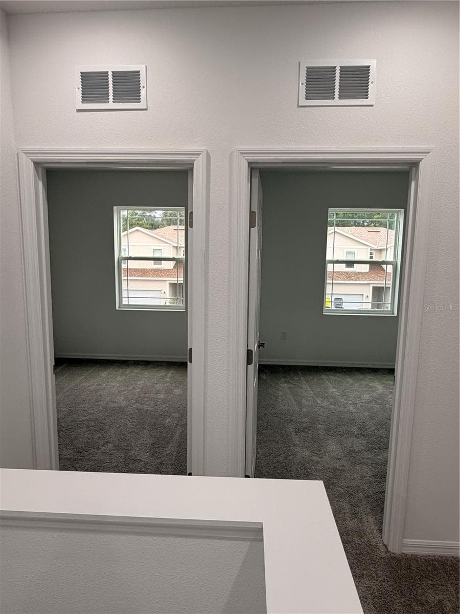 Entrance to 2nd and 3rd bedrooms - 915 LAKEFRONT VILLAGE DR, CLERMONT
