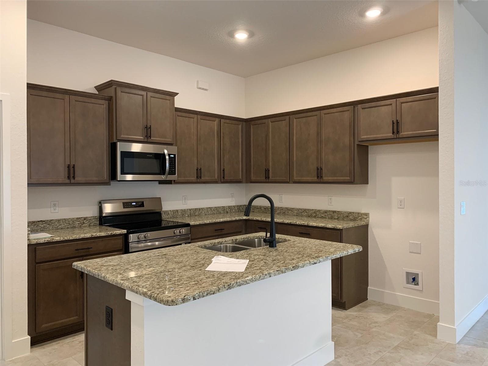 Island kitchen-wood cabinets & granite countertops - 11611 GRACE RD, WEEKI WACHEE