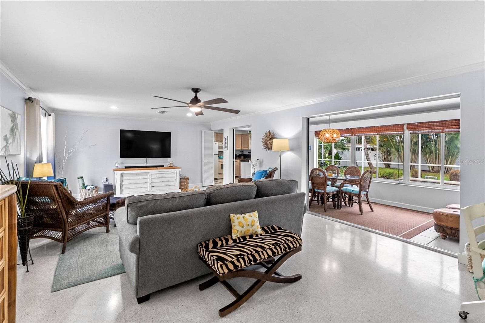 Living room opening to the adjoining Florida room. - 912 CHURCH ST, VENICE