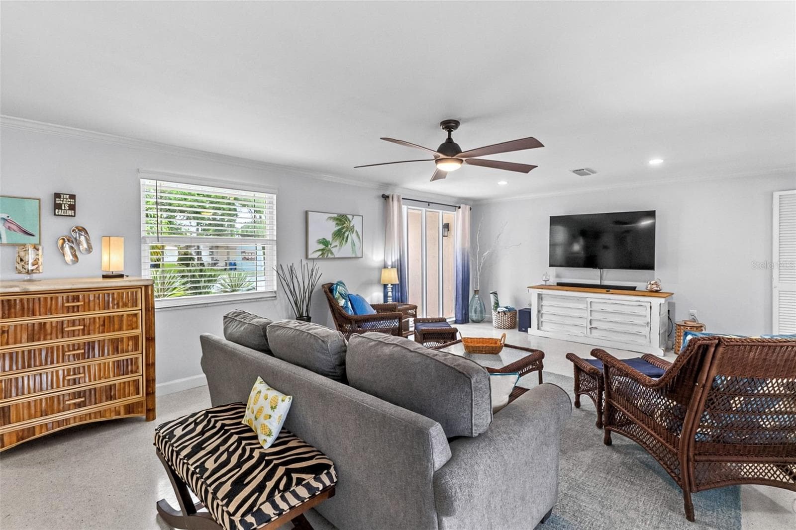 Living room with comfortable seating and coastal furnishings. - 912 CHURCH ST, VENICE