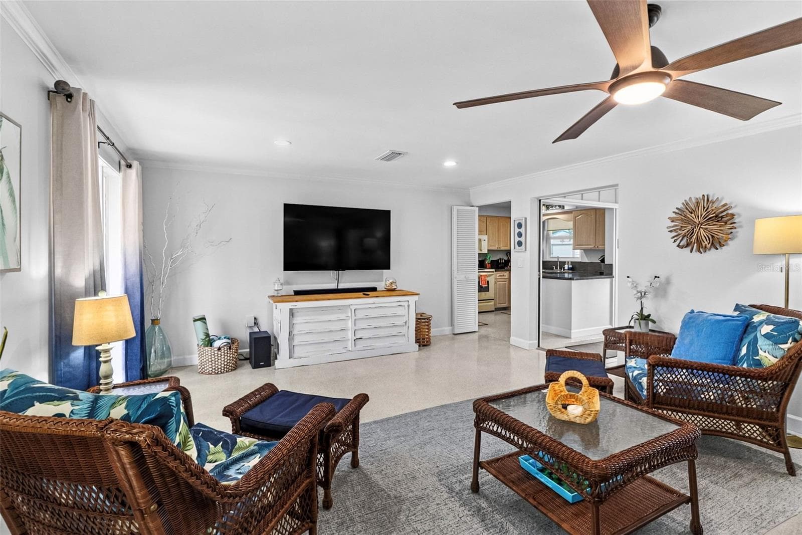 Living room seating area with tropical accents. - 912 CHURCH ST, VENICE