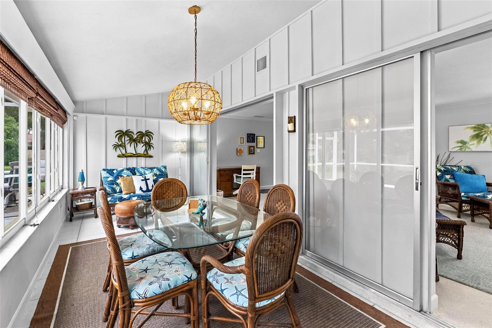 Florida room dining area and additional seating. - 912 CHURCH ST, VENICE
