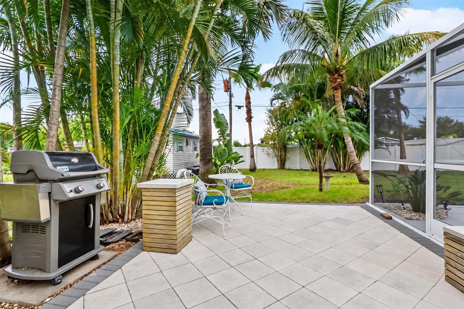 Outdoor patio with grilling and seating areas. - 912 CHURCH ST, VENICE