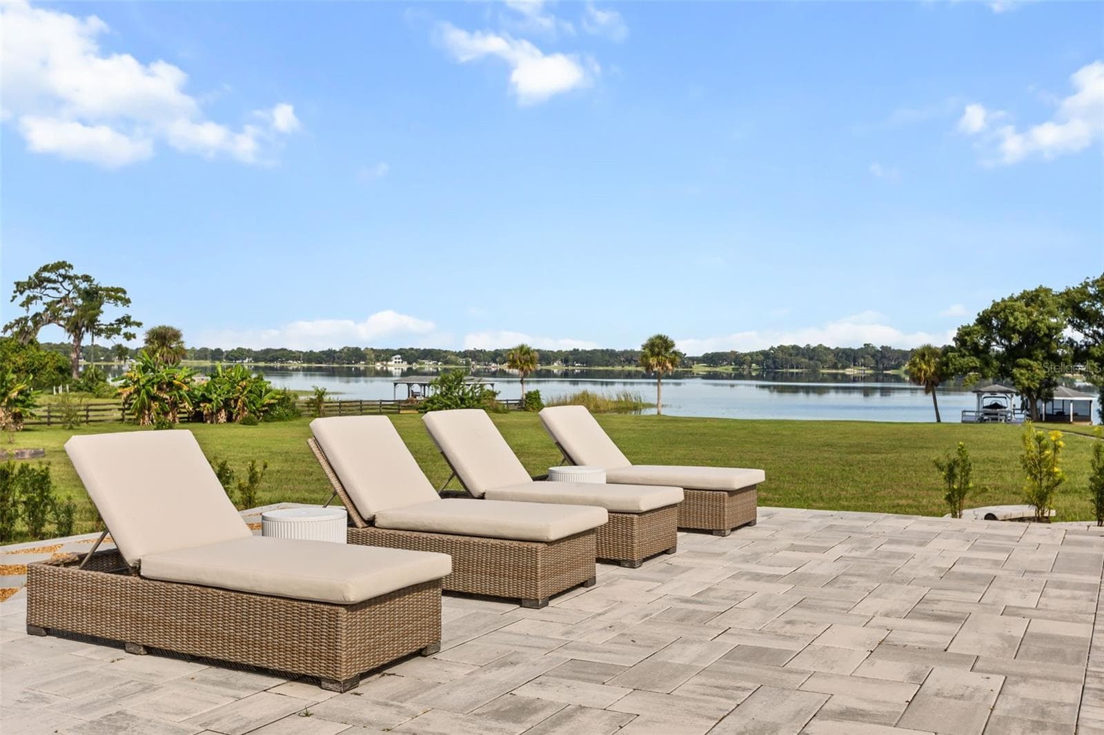 Lounging by pool with Lake Ola in view - 7703 SADLER RD, MOUNT DORA