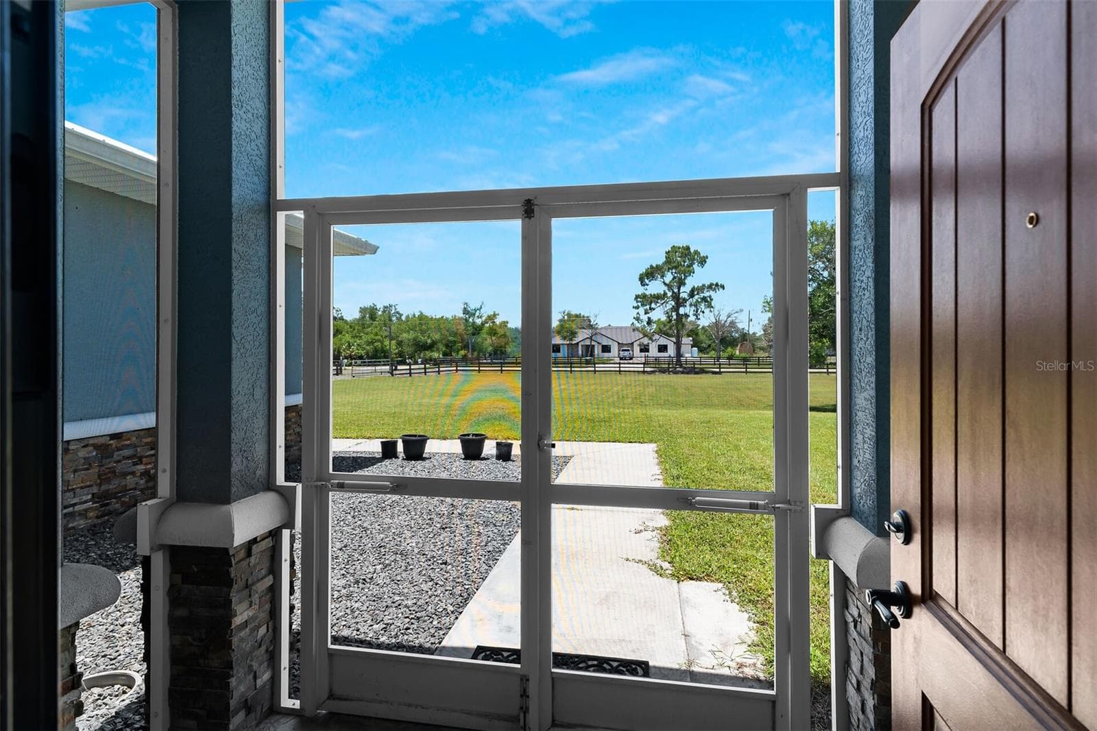 front door - 40200 LITTLE FARM RD, PUNTA GORDA