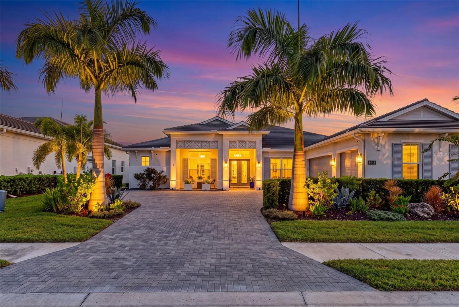 Illuminated Twilight Exterior - 8448 CANE BAY CT, LAKEWOOD RANCH