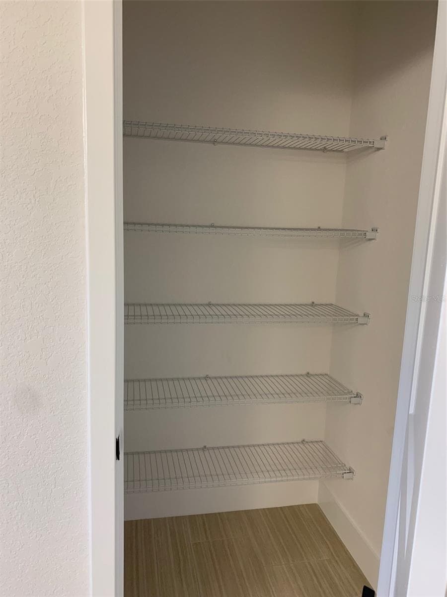 Linen closet in owners bath - 11619 GRACE RD, WEEKI WACHEE