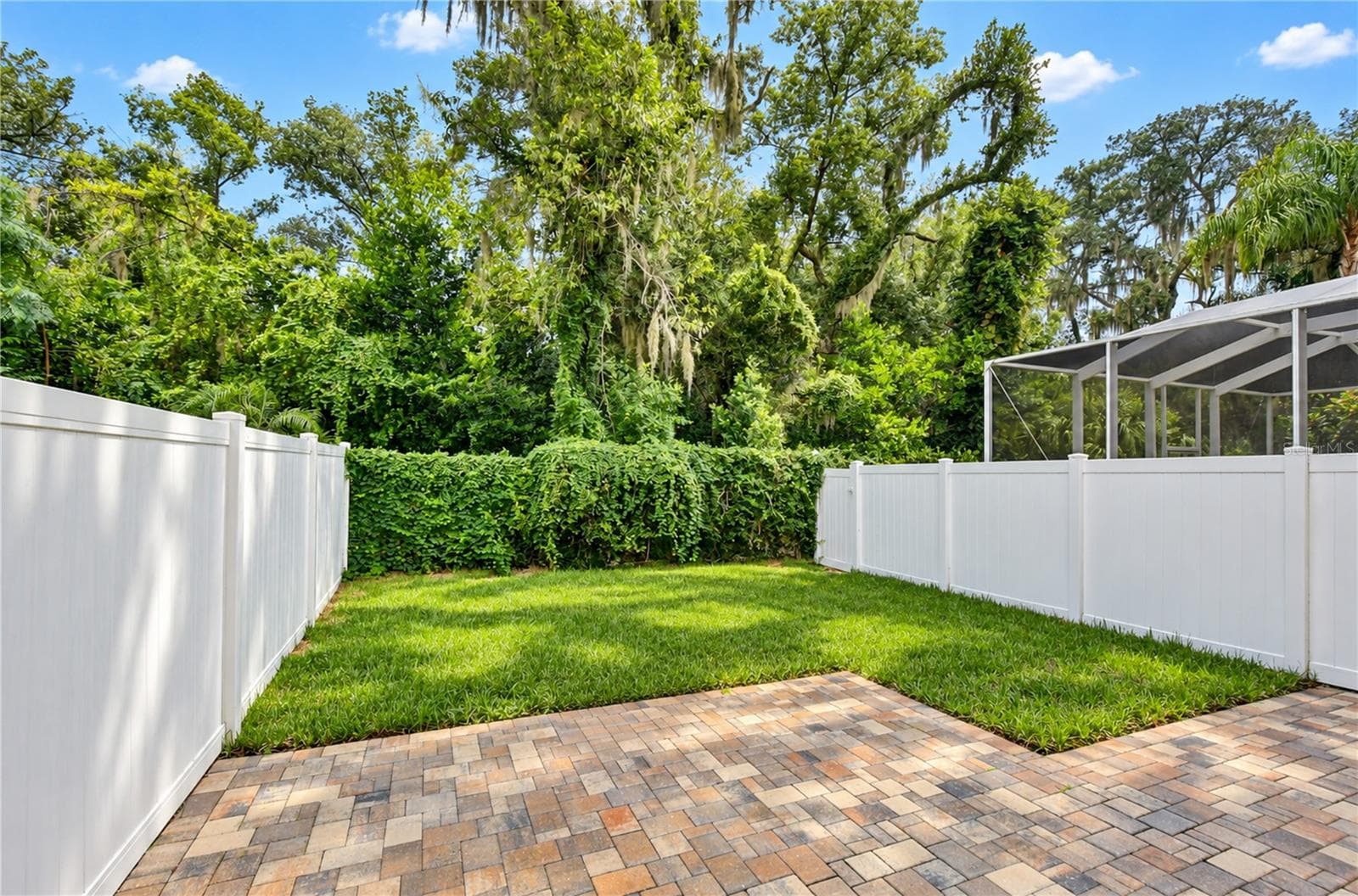 Established trees and beautifully landscaped surroundings create a peaceful community setting. - 828 LUMSDEN RESERVE DR, BRANDON