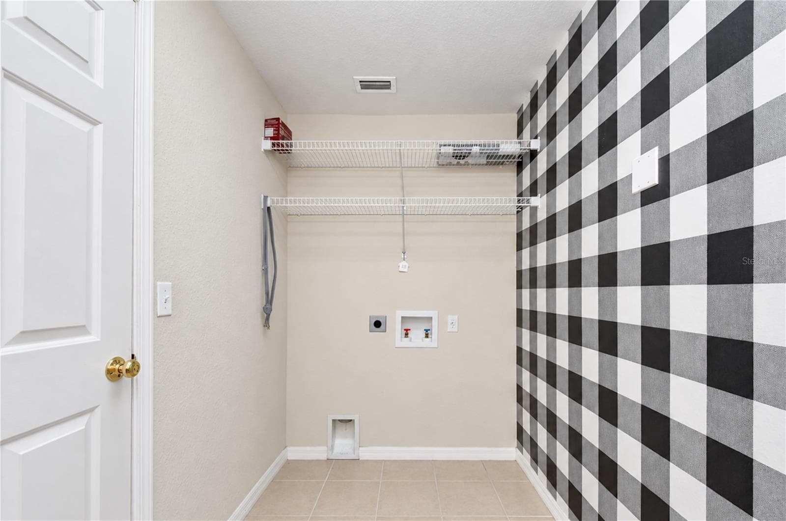Dedicated laundry room is conveniently located near all three bedrooms. - 828 LUMSDEN RESERVE DR, BRANDON
