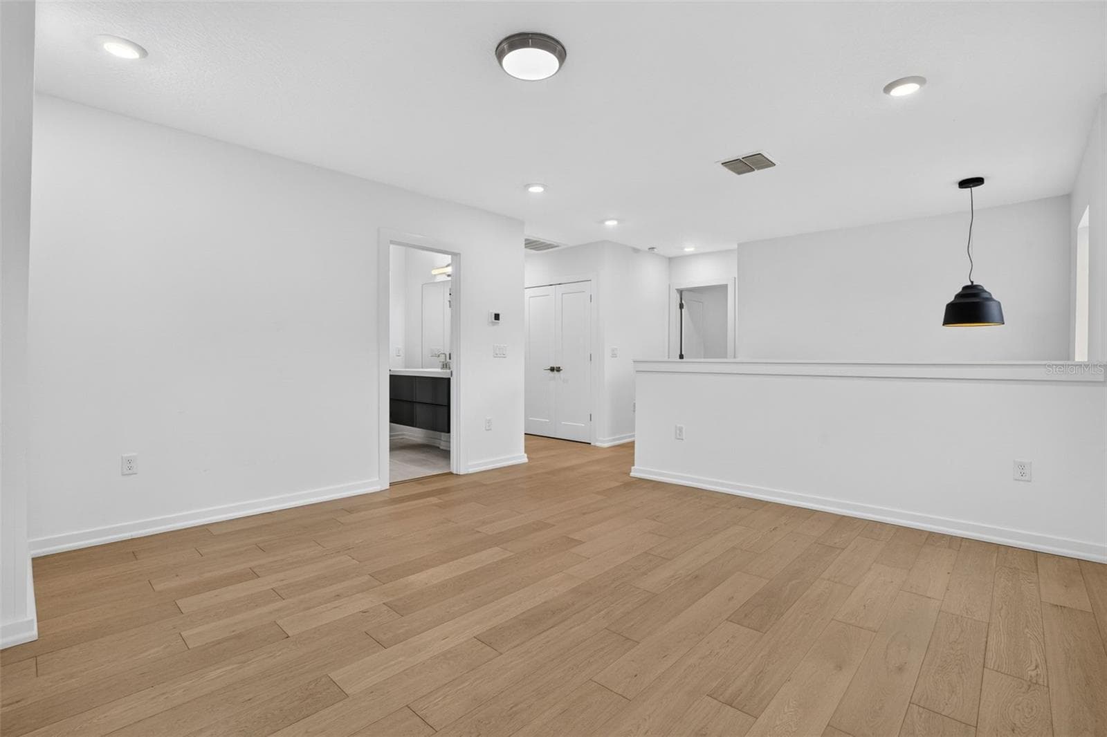 Stairwell and loft area leading to hallway-3 bedrooms and the primary Master Suite. - 5818 1/2 S 6TH ST, TAMPA