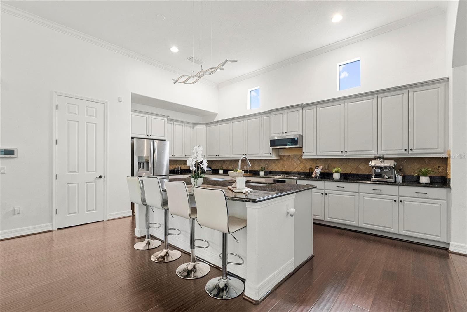 Kitchen-Expansive Island With Bar Seating - 8264 DUNHAM STATION DR, TAMPA