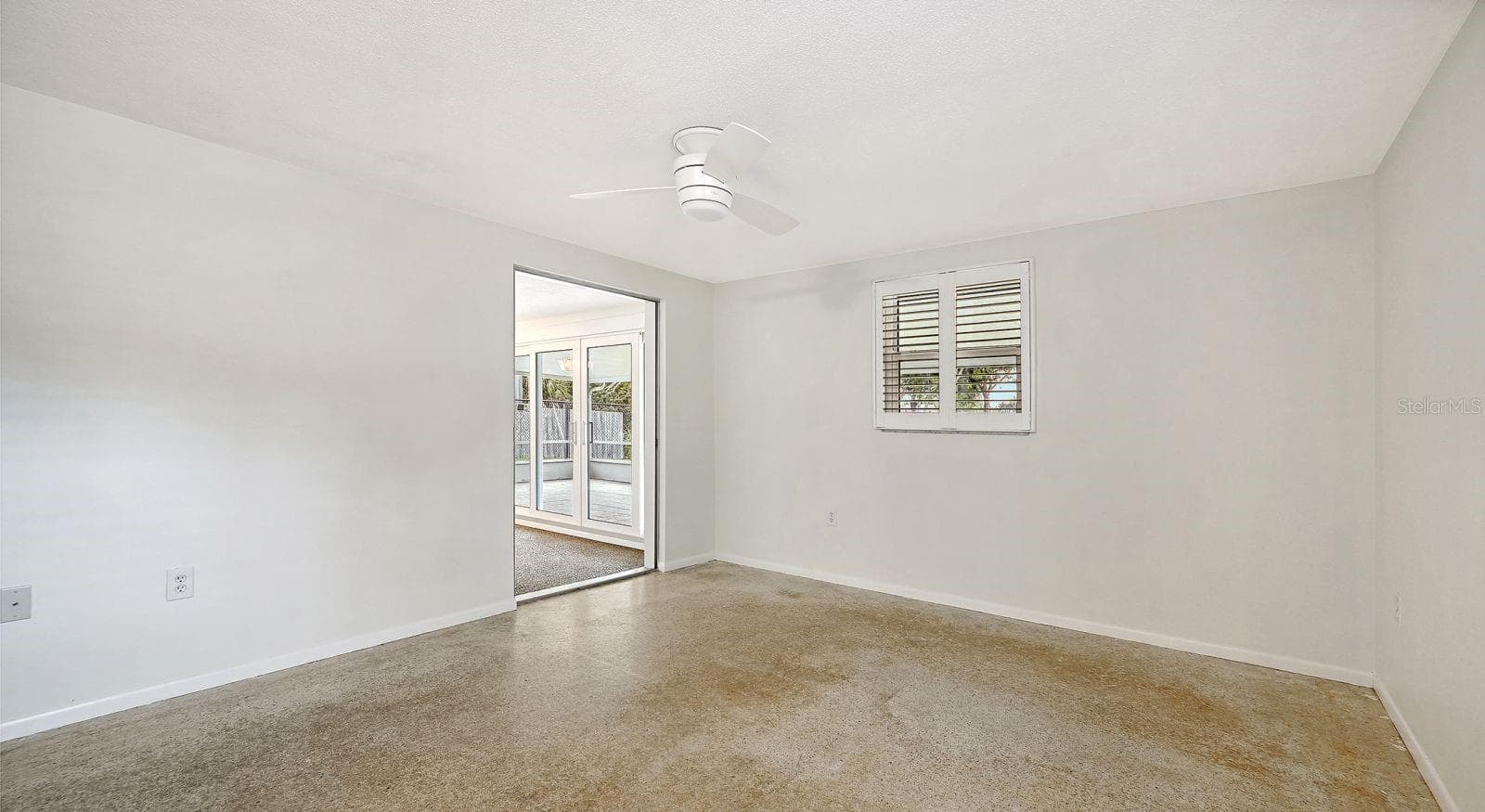 Primary Bedroom with Plantation Shutters - 2610 REGATTA DR, SARASOTA
