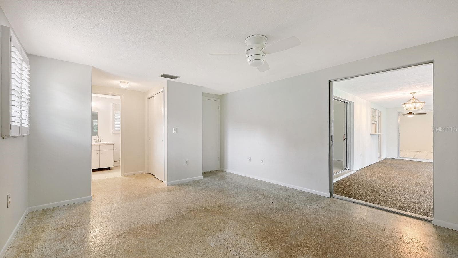 Primary Bedroom and Primary Bathroom - 2610 REGATTA DR, SARASOTA