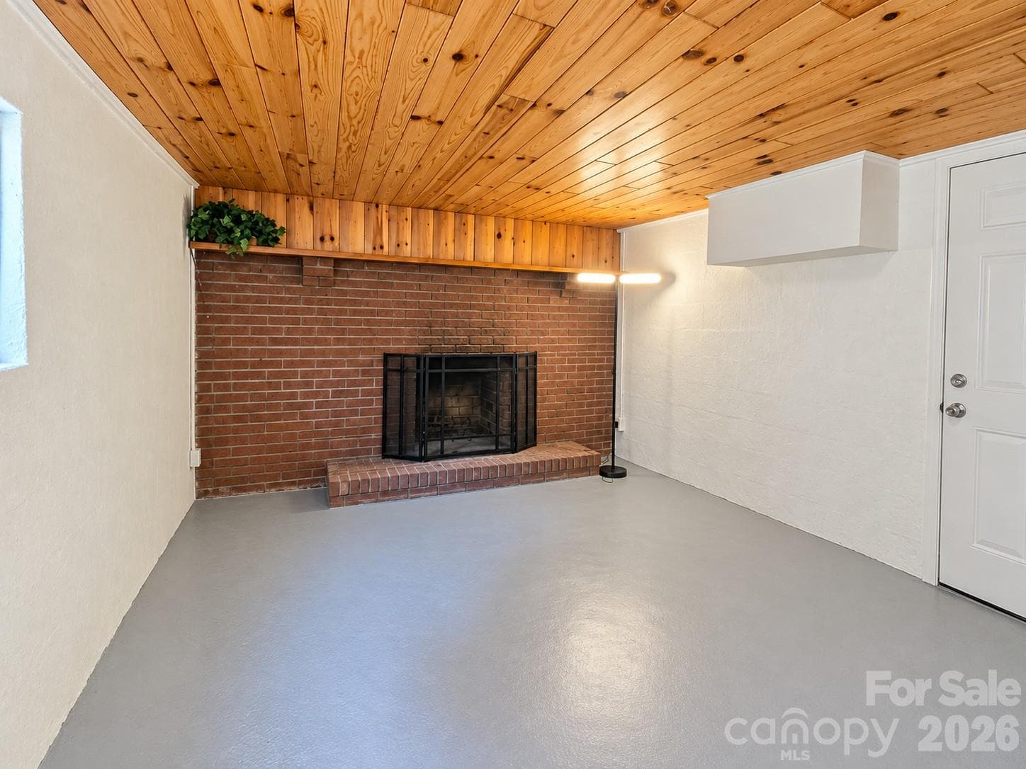 Basement Bedroom/ Rec Room with wood- burning fireplace - 1627 W Lakewood Drive, Rock Hill