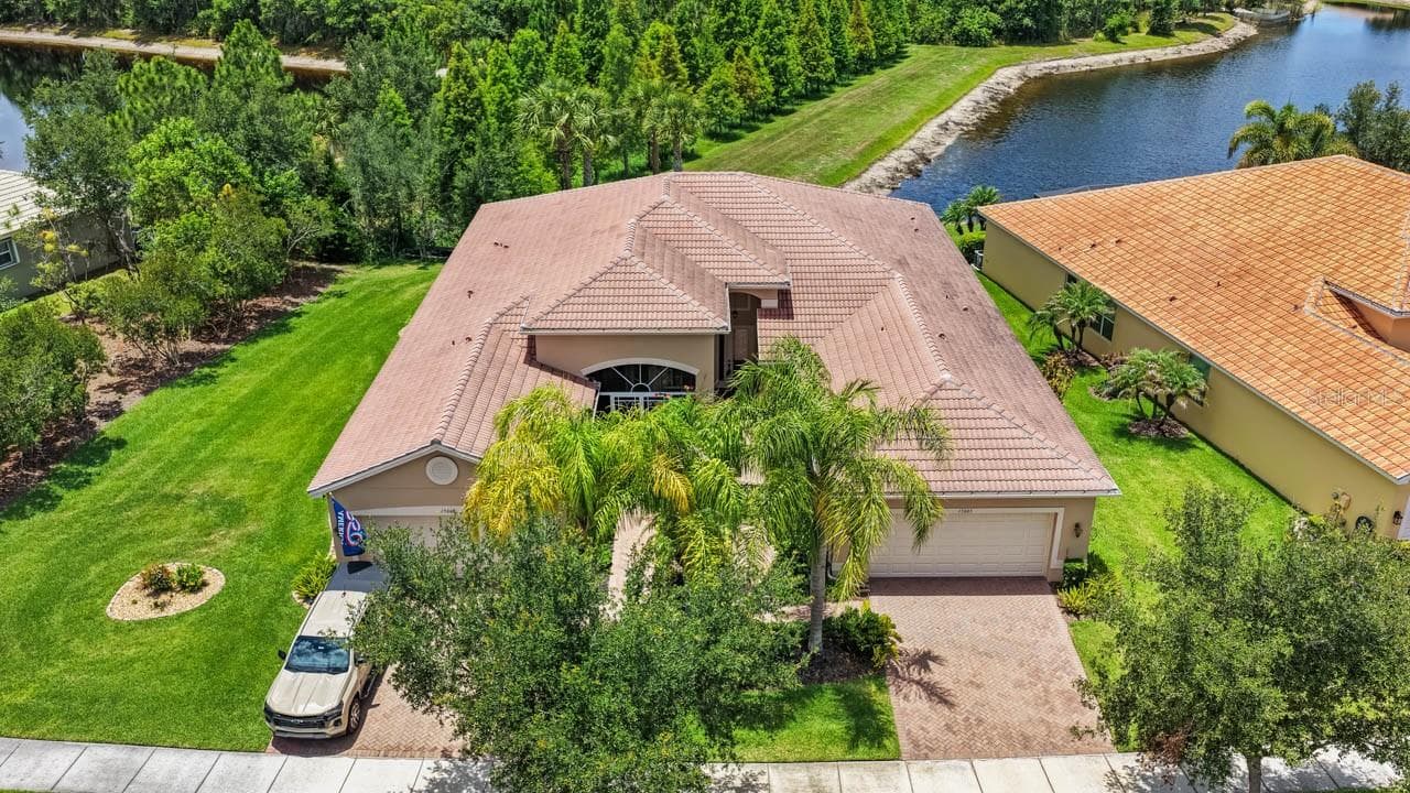 House is on the right - 15665 AURORA LAKE CIR, WIMAUMA