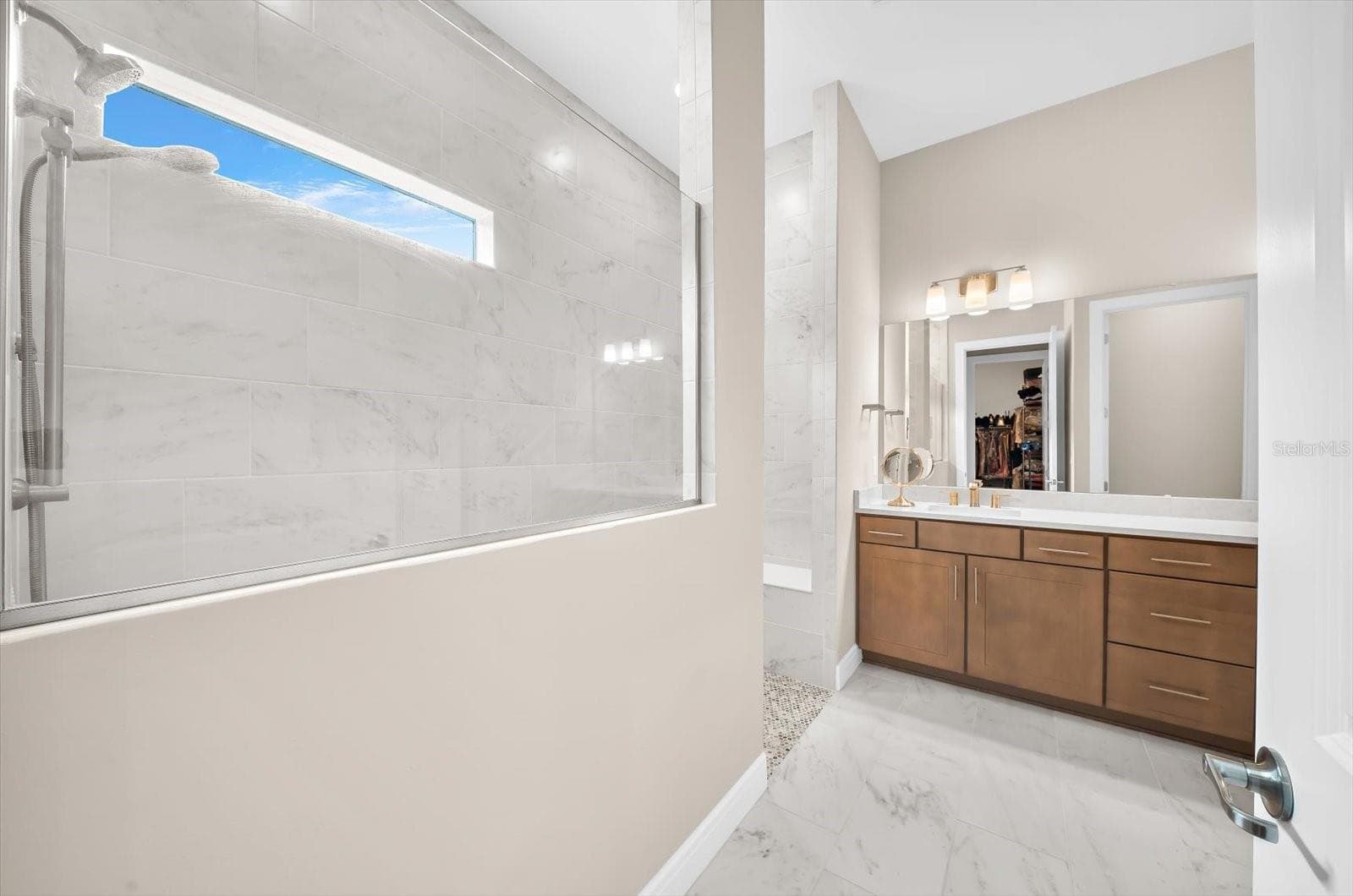 Primary bathroom with dual sinks and large walk-in shower - 10716 SARATOGA PL, PARRISH