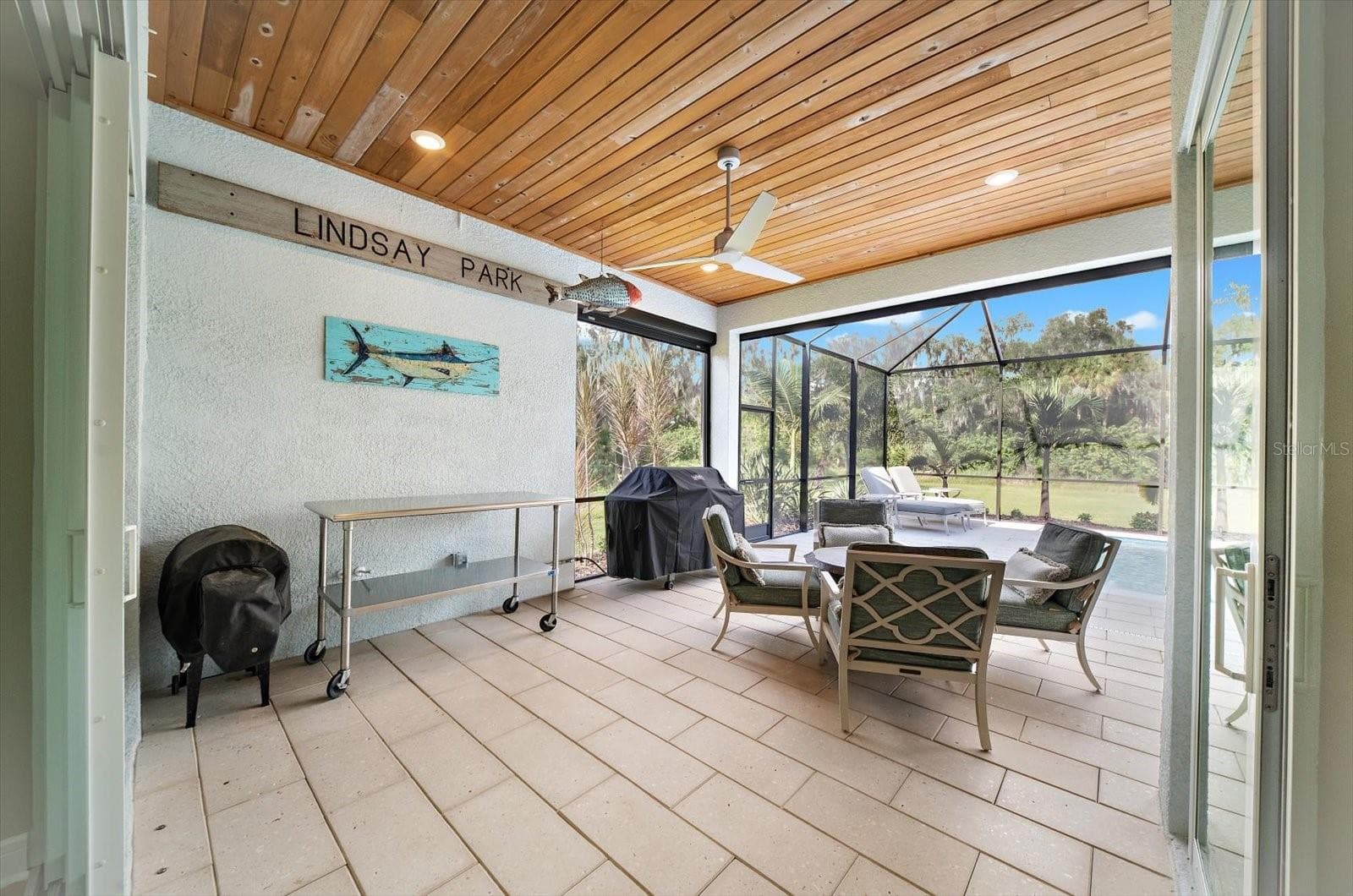 Seating area overlooking the pool - 10716 SARATOGA PL, PARRISH