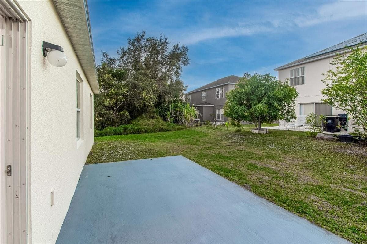 Large backyard with Concrete pad for your future workshop - 1200 WAHNETA DR, KISSIMMEE