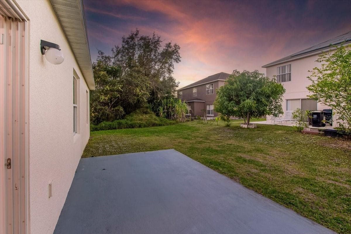 Large backyard with Concrete pad for your future workshop - 1200 WAHNETA DR, KISSIMMEE