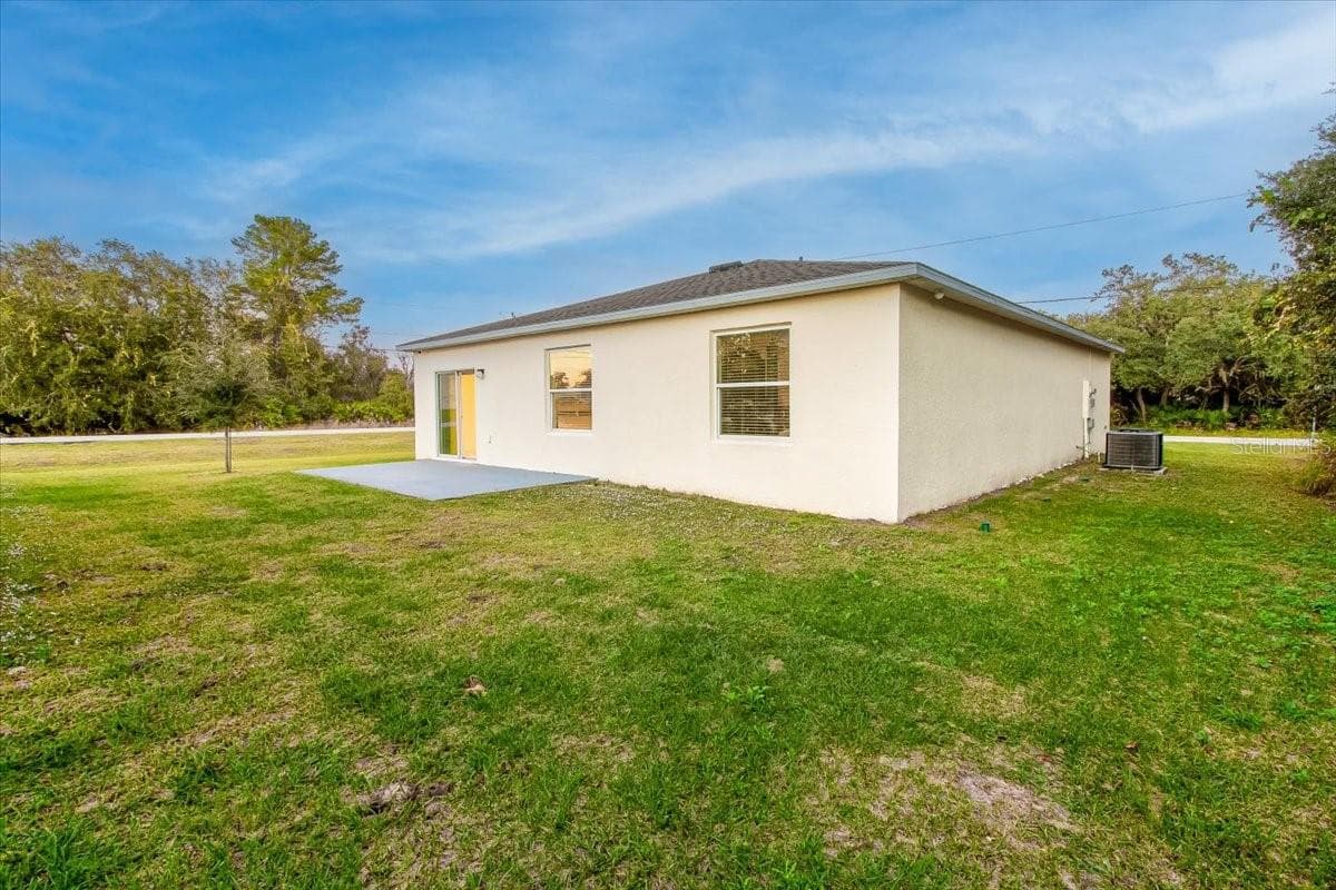 Large backyard with Concrete pad for your future workshop - 1200 WAHNETA DR, KISSIMMEE