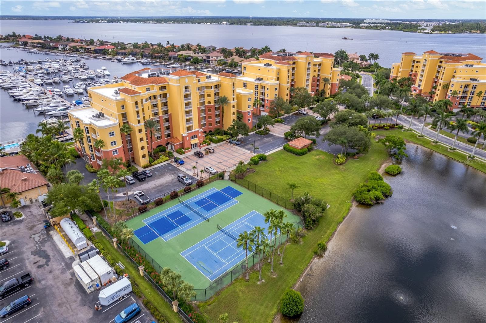 Great access to the tennis and pickleball courts or a quick stroll next door to the Dockside Grill to meet friends for dinner or cocktails. - 606 RIVIERA DUNES WAY #405, PALMETTO