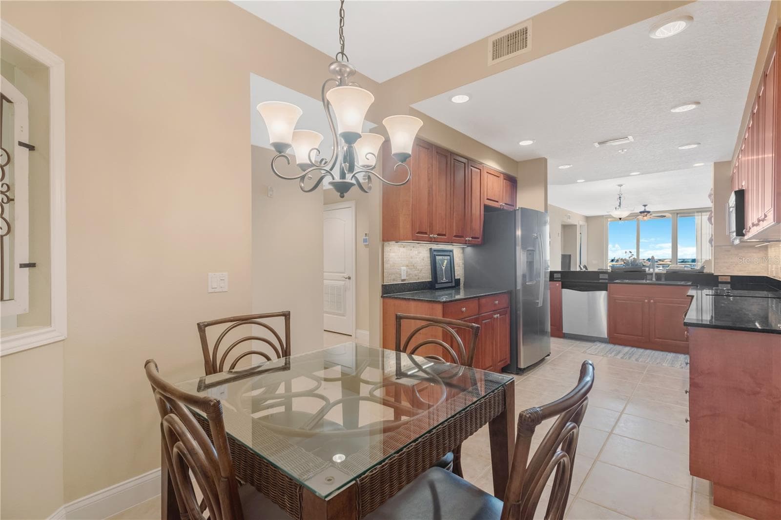 Eat-in Kitchen area. Stainless steel appliances and new (2025) counter depth Refrigerator. - 606 RIVIERA DUNES WAY #405, PALMETTO