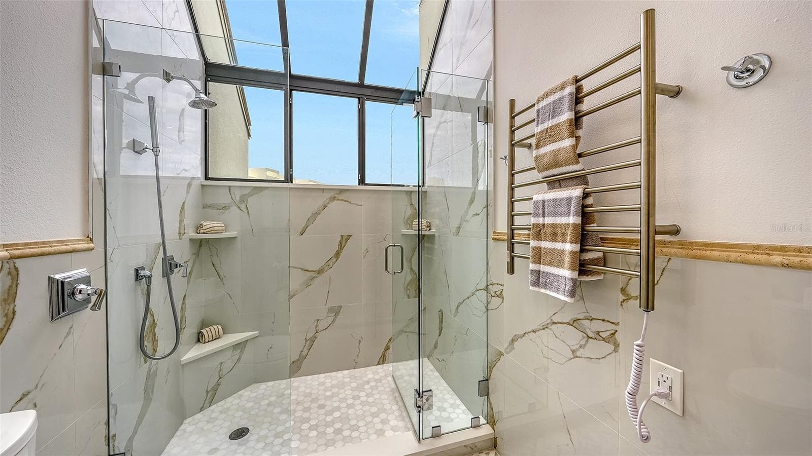 THE TOWEL WARMER W/ THE GARDEN WINDOW IN THE PRIMARY BATHROOM - 1916 HARBOURSIDE DR #804, LONGBOAT KEY