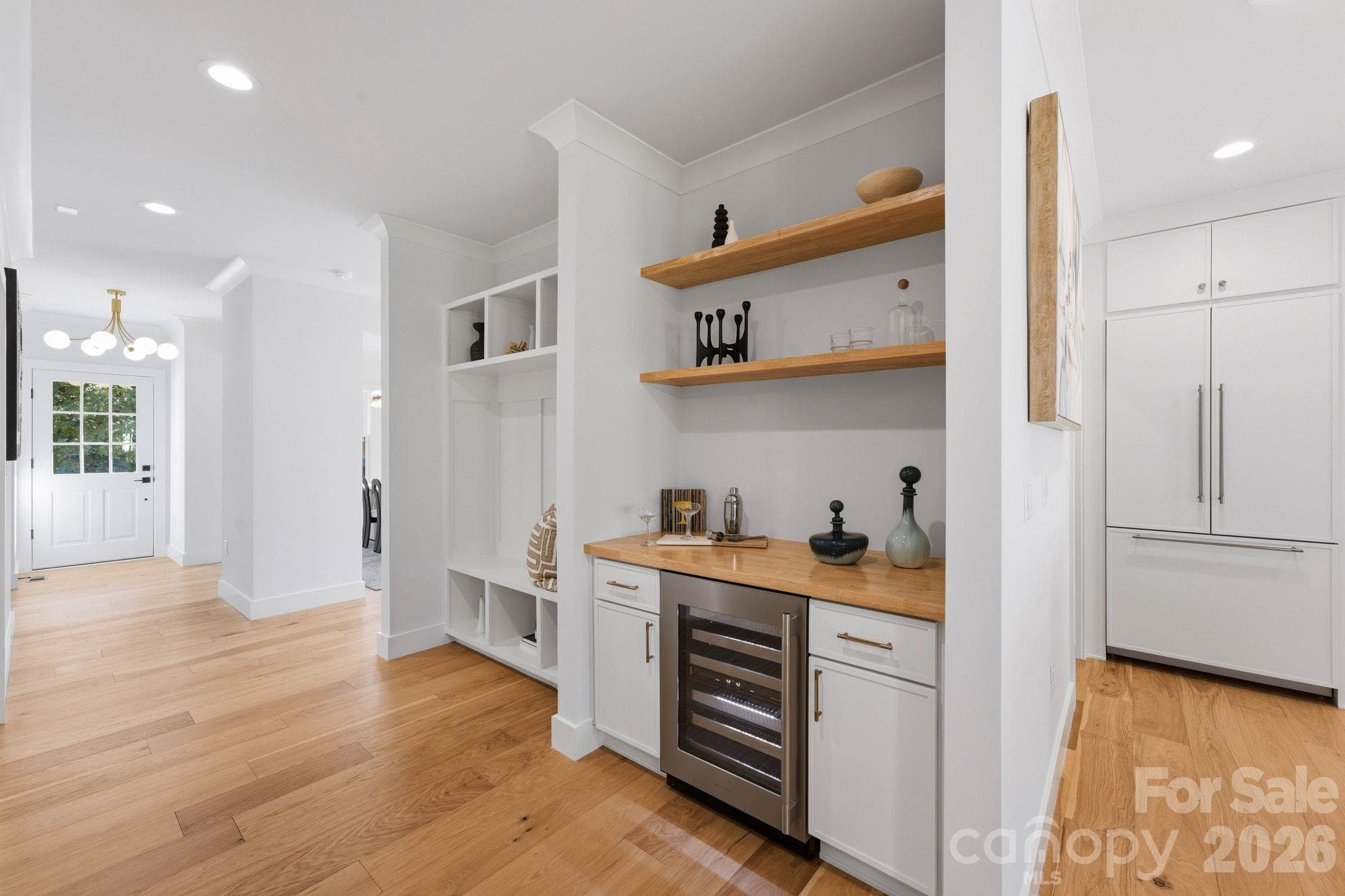 Custom built-ins storage and bar area in the hallway off the main living area - 1740 Merriman Avenue, Charlotte