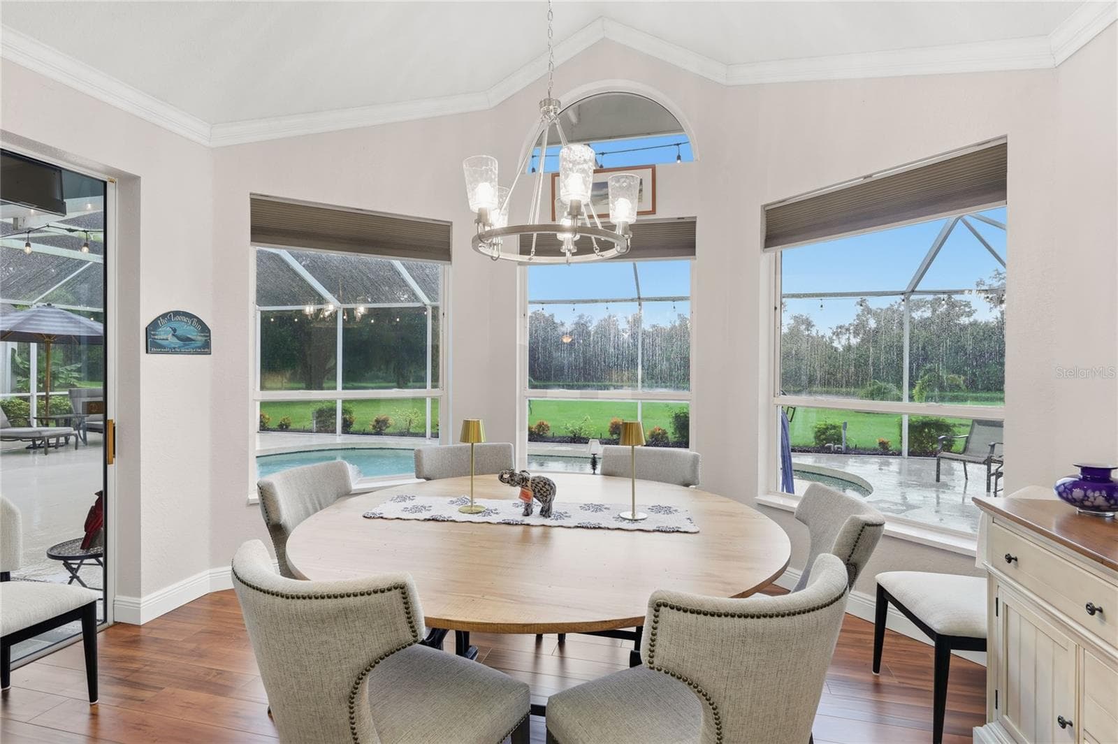 Florida dining room poolside with a lake view - 3306 LITTLE COUNTRY RD, PARRISH