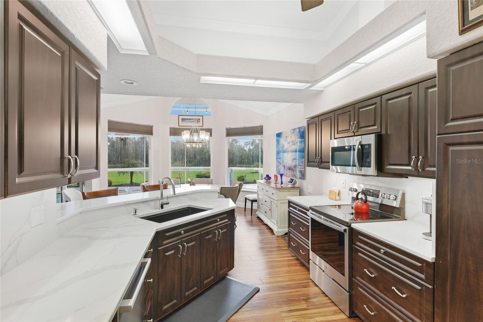 Updated kitchen appliances include a Bosch Benchmark dishwasher, GE profile range, and Bosch refrigerator. - 3306 LITTLE COUNTRY RD, PARRISH