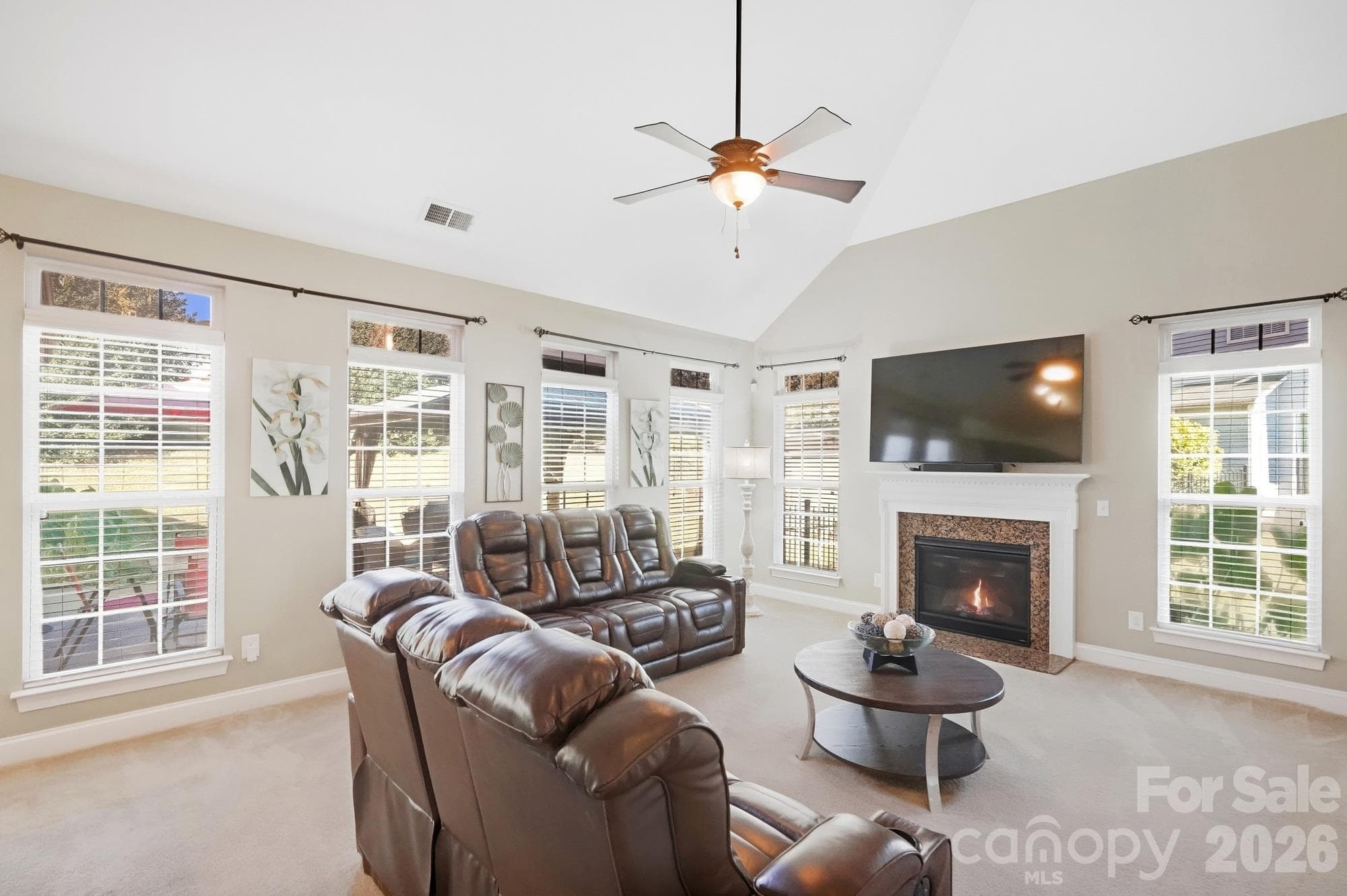 Family room with Gas Fire place, lots of windows - 10110 Loch Lomond Drive, Charlotte