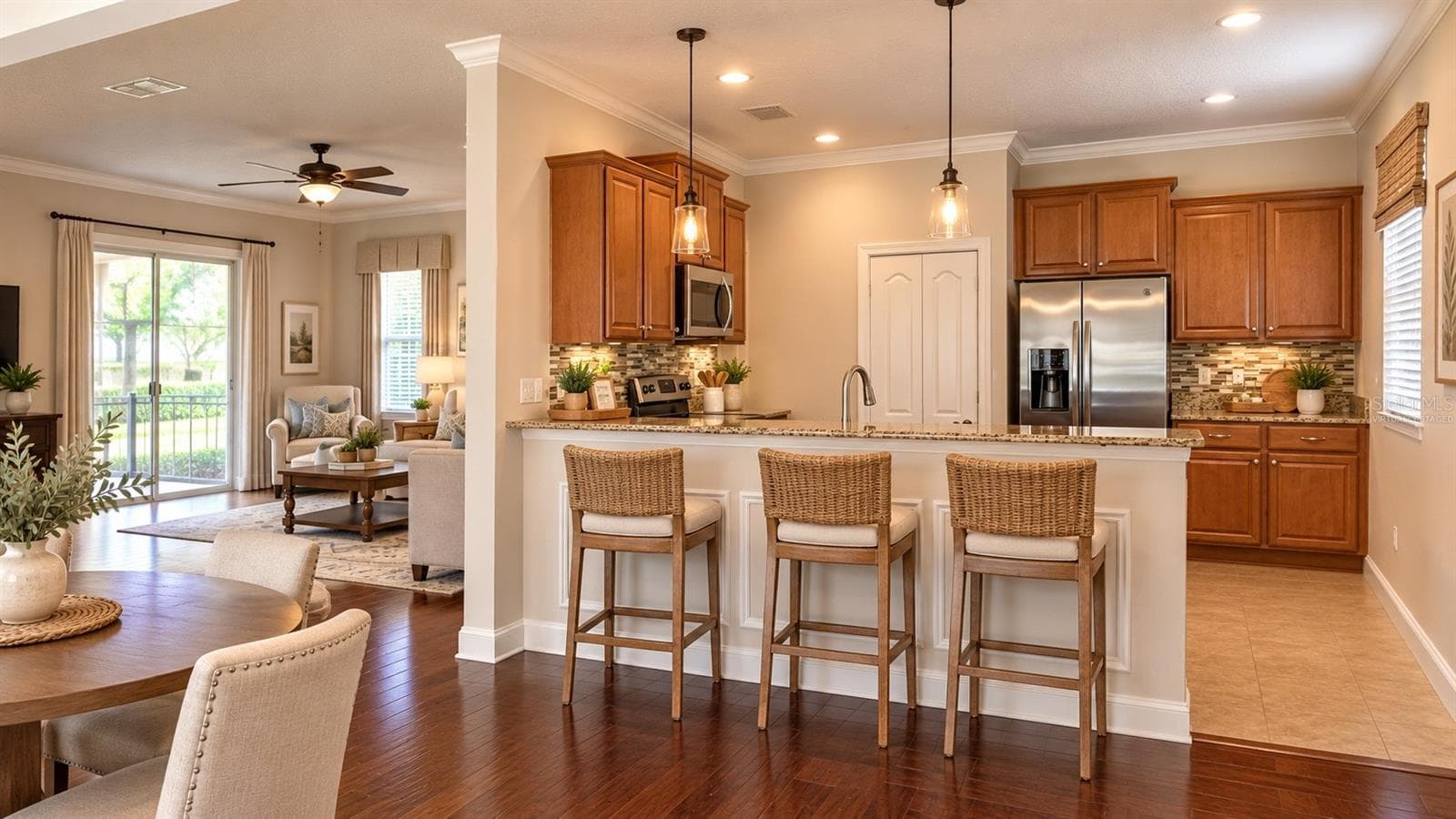 VIRTUALLY STAGED LIVING ROOM, EAT IN KITCHEN AREA,  & KITCHEN WITH FURNITURE - 4056 SERENA LN, CLERMONT