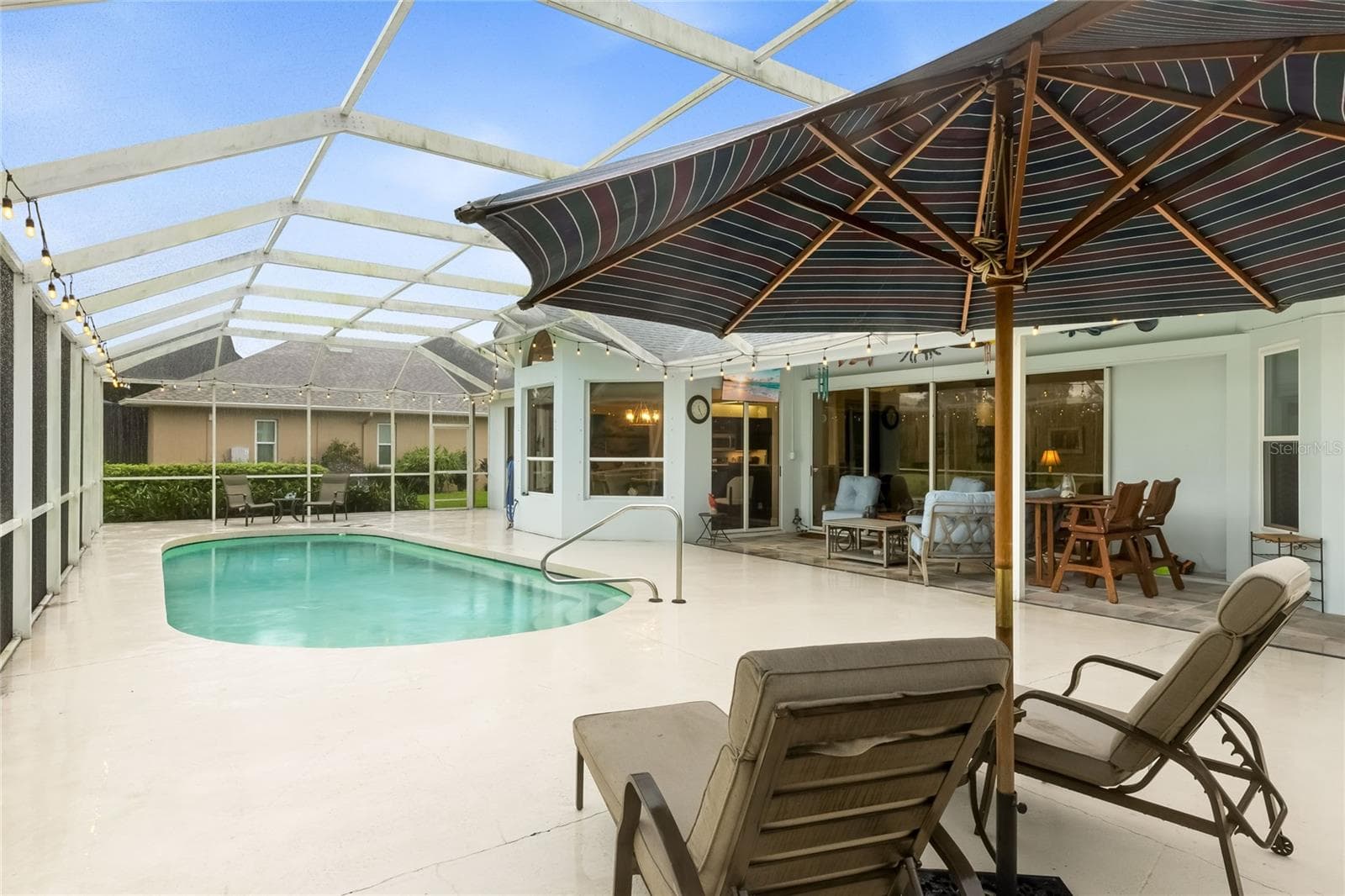 Lounge on your poolside lanai while enjoying the lakeside view - 3306 LITTLE COUNTRY RD, PARRISH