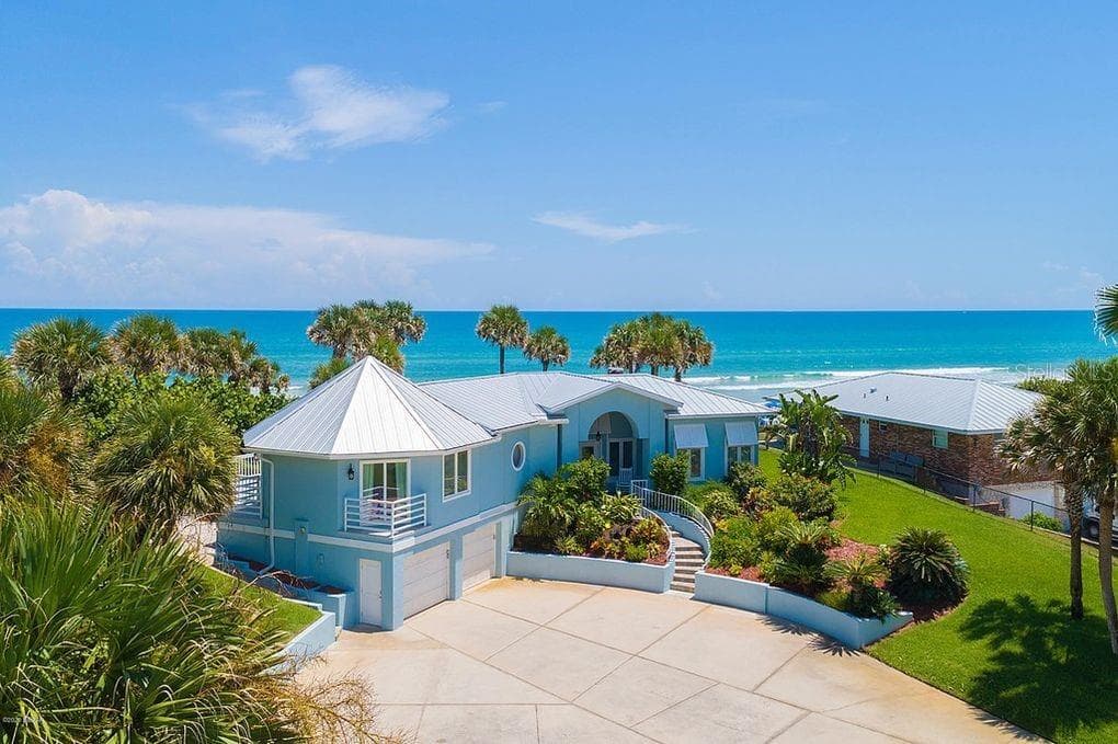 Set on over three-quarters of an acre with approximately 85 feet of ocean frontage, this property offers a generous setback from the road, ample driveway parking, and an attached garage. Neighboring Frank Rendon Park features a playground, covered picnic areas, restrooms, public beach access, and parking - 2707 S ATLANTIC AVE, DAYTONA BEACH SHORES