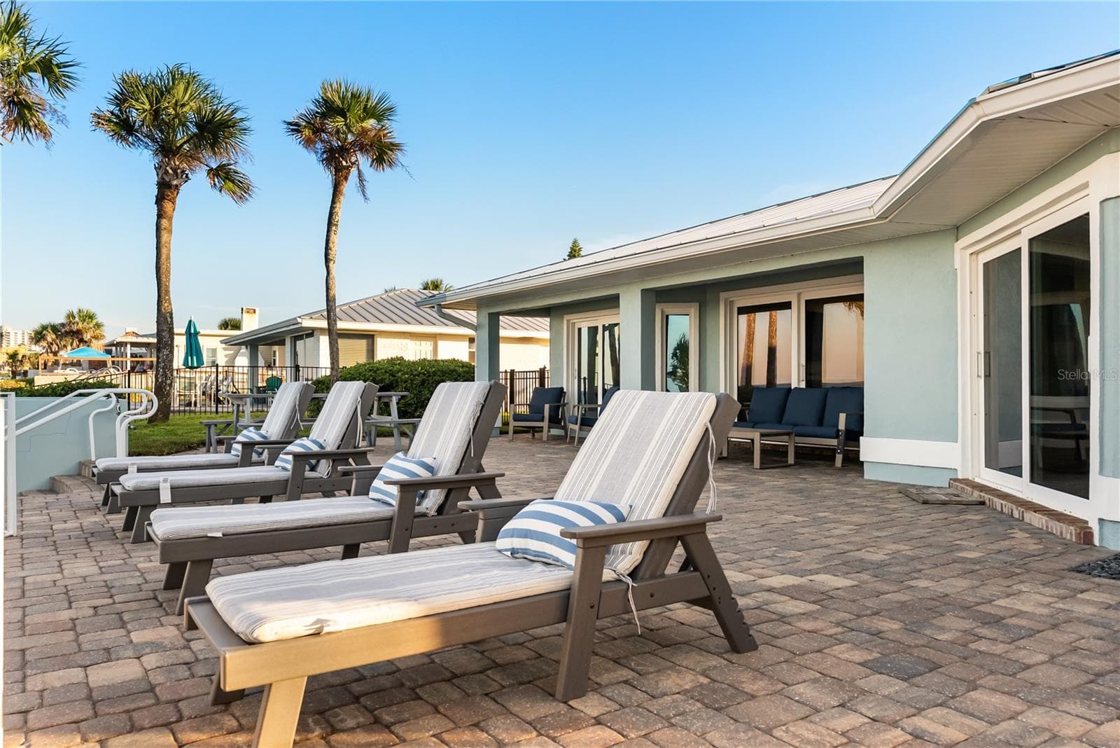 new poolNew oceanfront pool installed in 2024, featuring heating, a sun shelf, bubblers, and a 7-foot-deep end, with expansive patio space and panoramic Atlantic views - 2707 S ATLANTIC AVE, DAYTONA BEACH SHORES