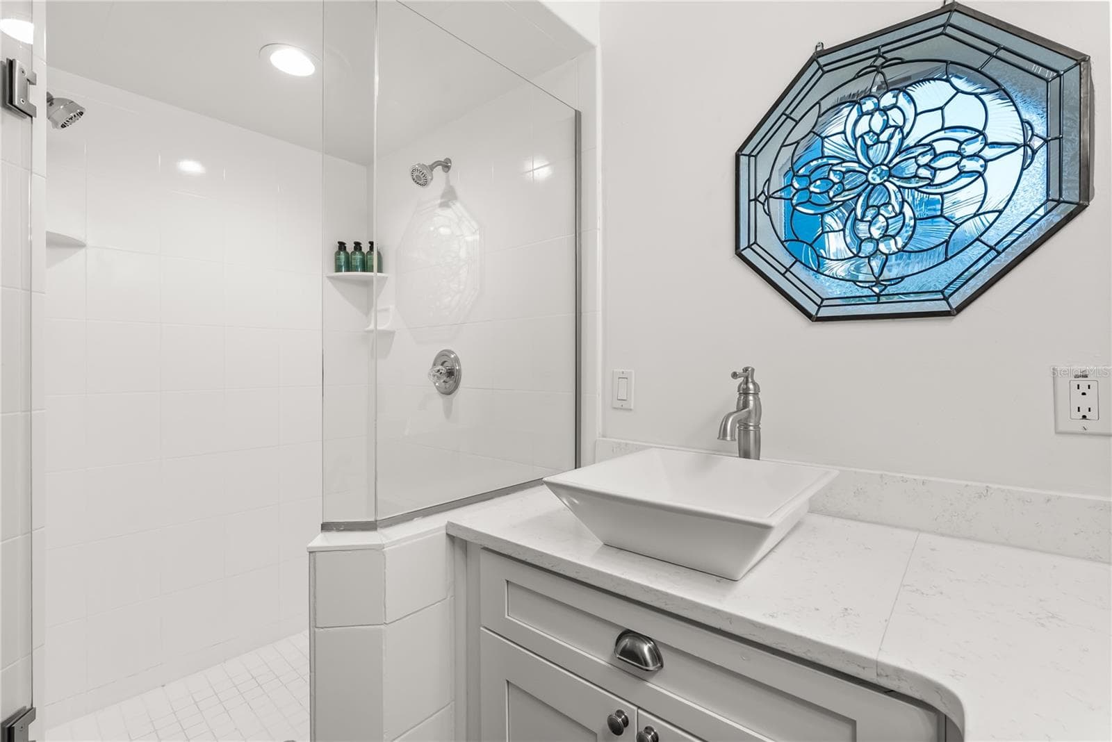 Master ensuite bathroom with updated finishes and statement window and skylight - 2707 S ATLANTIC AVE, DAYTONA BEACH SHORES