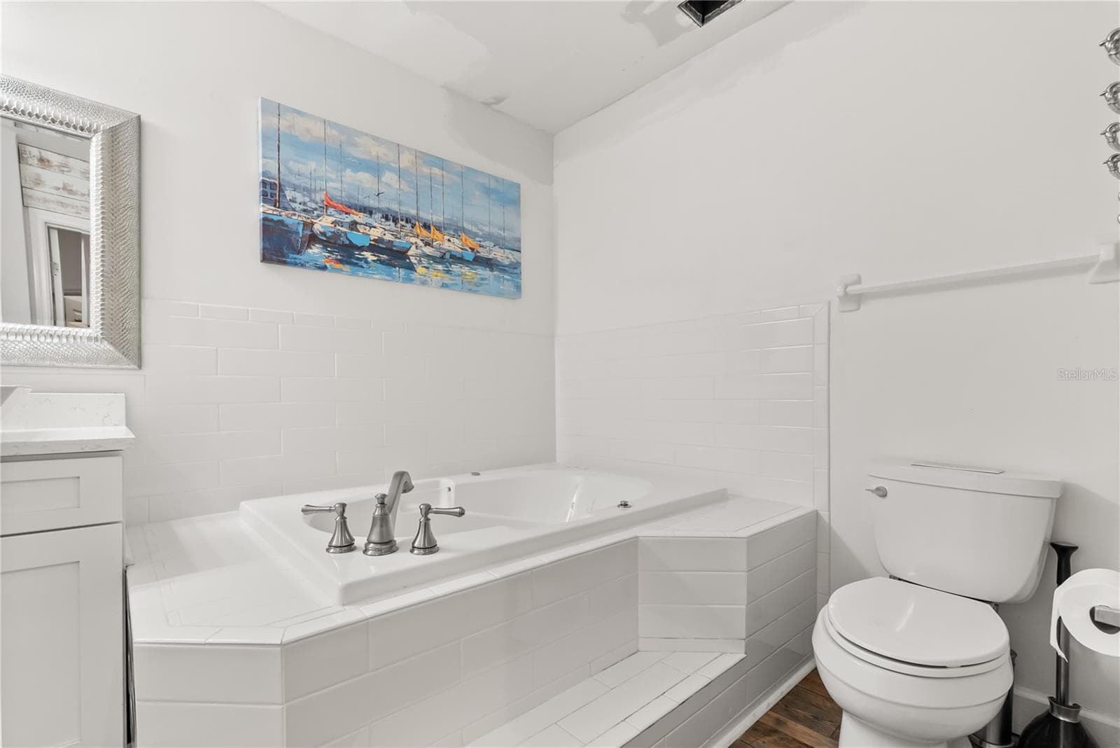 Master ensuite bathroom with updated finishes and statement window and skylight - 2707 S ATLANTIC AVE, DAYTONA BEACH SHORES