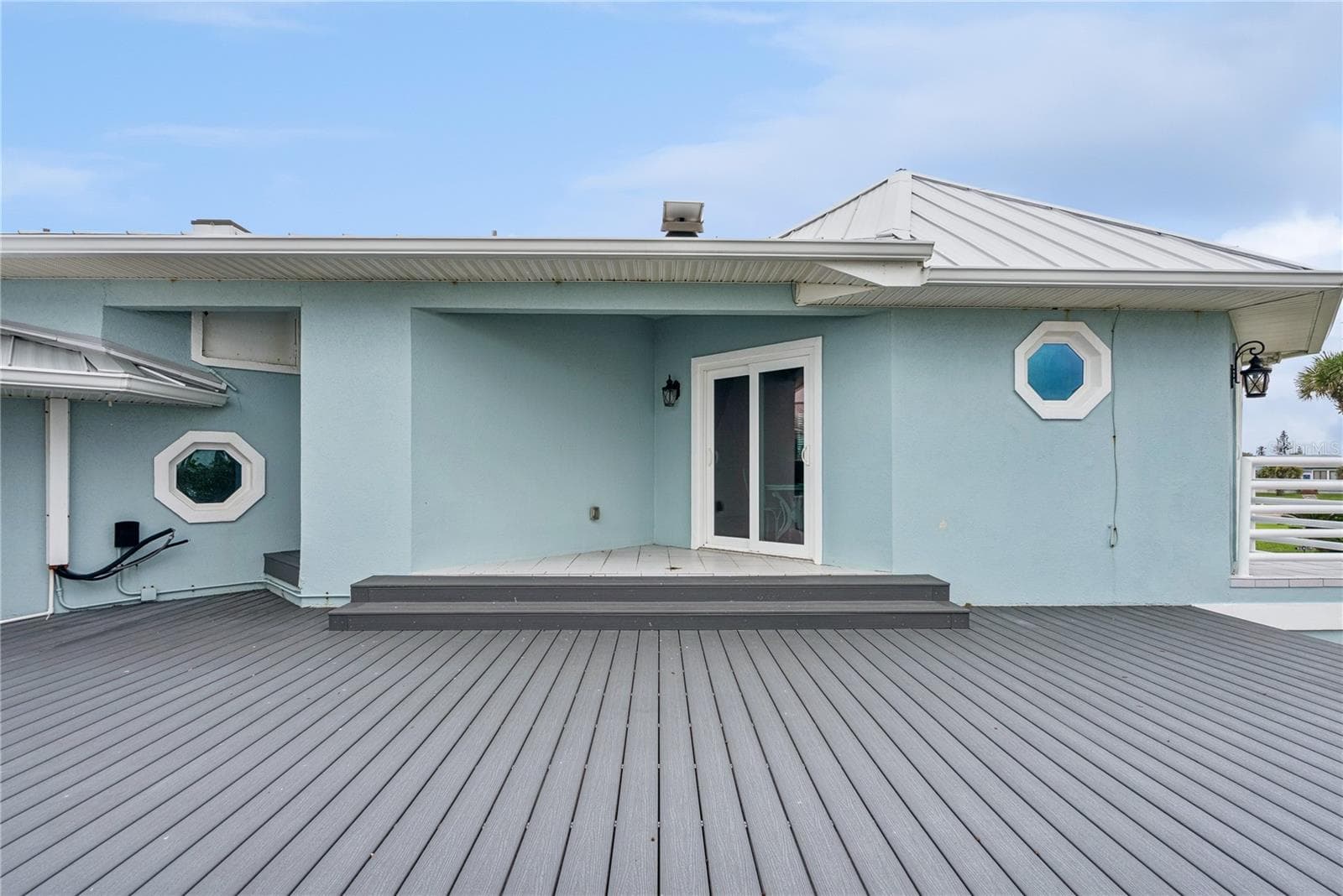 Newly added composite decking located directly off the master bedroom to enjoy ocean views with your morning coffee. - 2707 S ATLANTIC AVE, DAYTONA BEACH SHORES