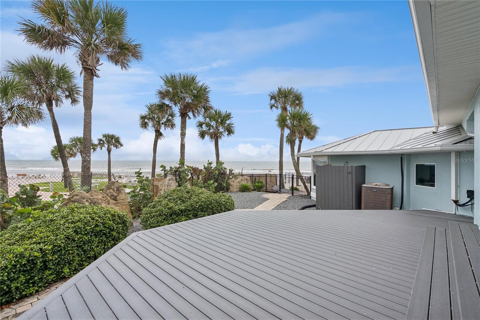 Newly added composite decking located directly off the master bedroom to enjoy ocean views with your morning coffee. - 2707 S ATLANTIC AVE, DAYTONA BEACH SHORES