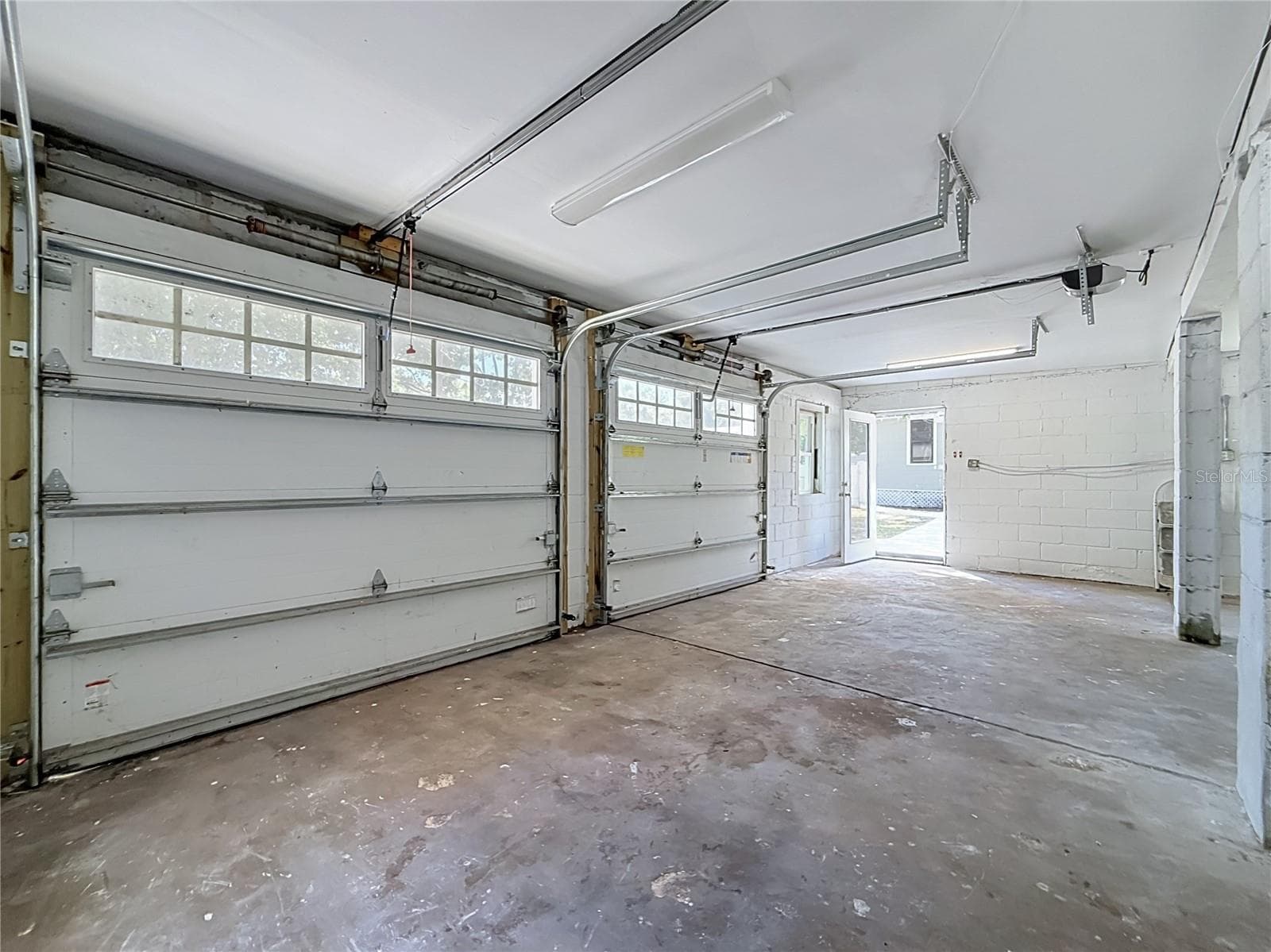 Rare DETACHED BLOCK 2-CAR GARAGE with NEW ROOF and ALLEY ACCESS and additional parking! This versatile space offers endless possibilities! Keep it as a traditional 2 car garage, create a WORKSHOP, HOME GYM, ART STUDIO, or PERSONAL HANGOUT, or explore the potential for an ACCESSORY DWELLING UNIT (ADU) for guest accommodations or possible rental income, subject to city approval and permitting - 509 27TH AVE S, ST PETERSBURG