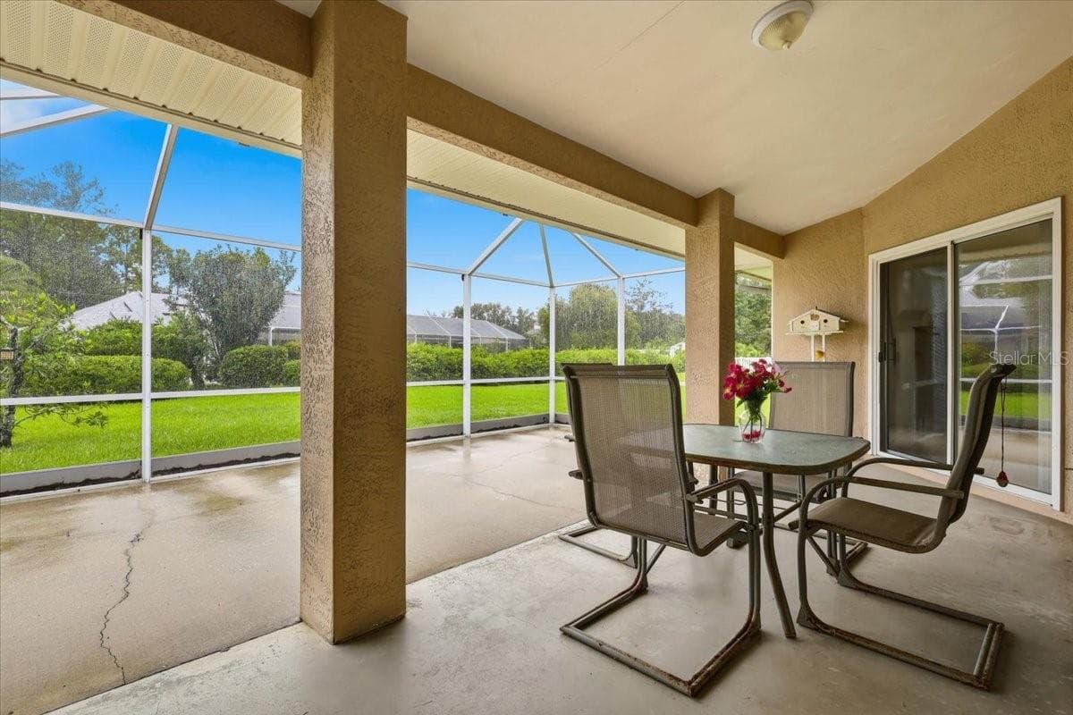 Screened Patio with 3 access sliders - 65 WOODBURY DR, PALM COAST