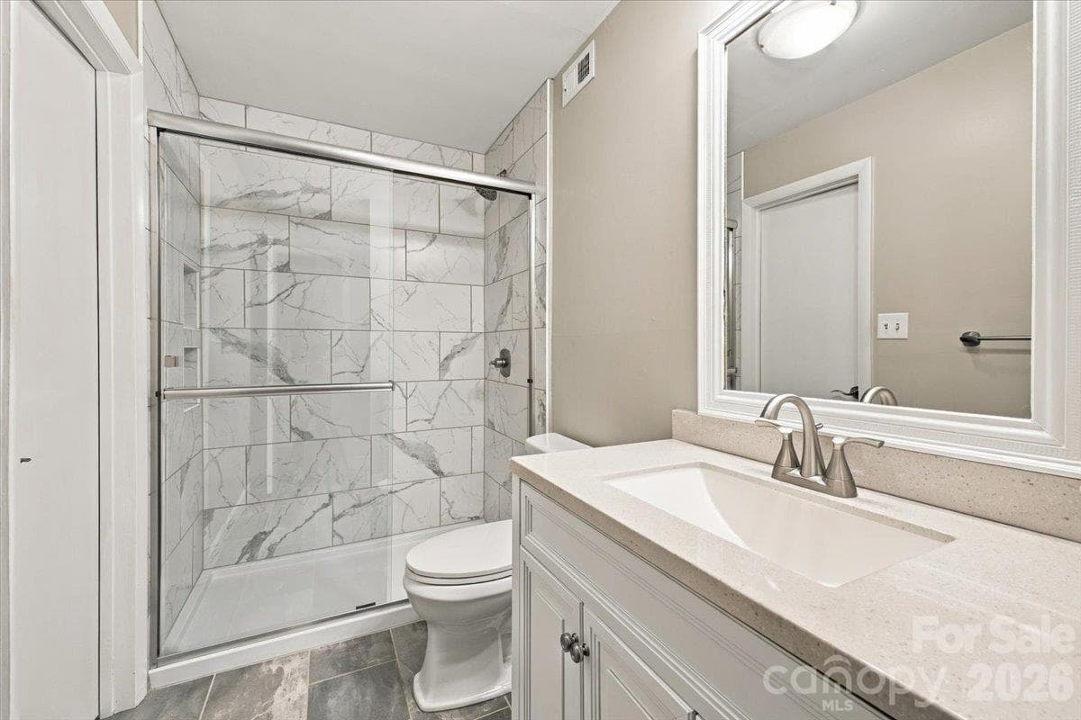 Basement level full bathroom ensuite to basement bedroom - 5805 Sharon Road, Charlotte
