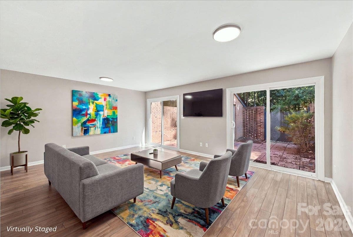 (virtually staged) Basement level with open concept living space and bedroom with ensuite - 5805 Sharon Road, Charlotte