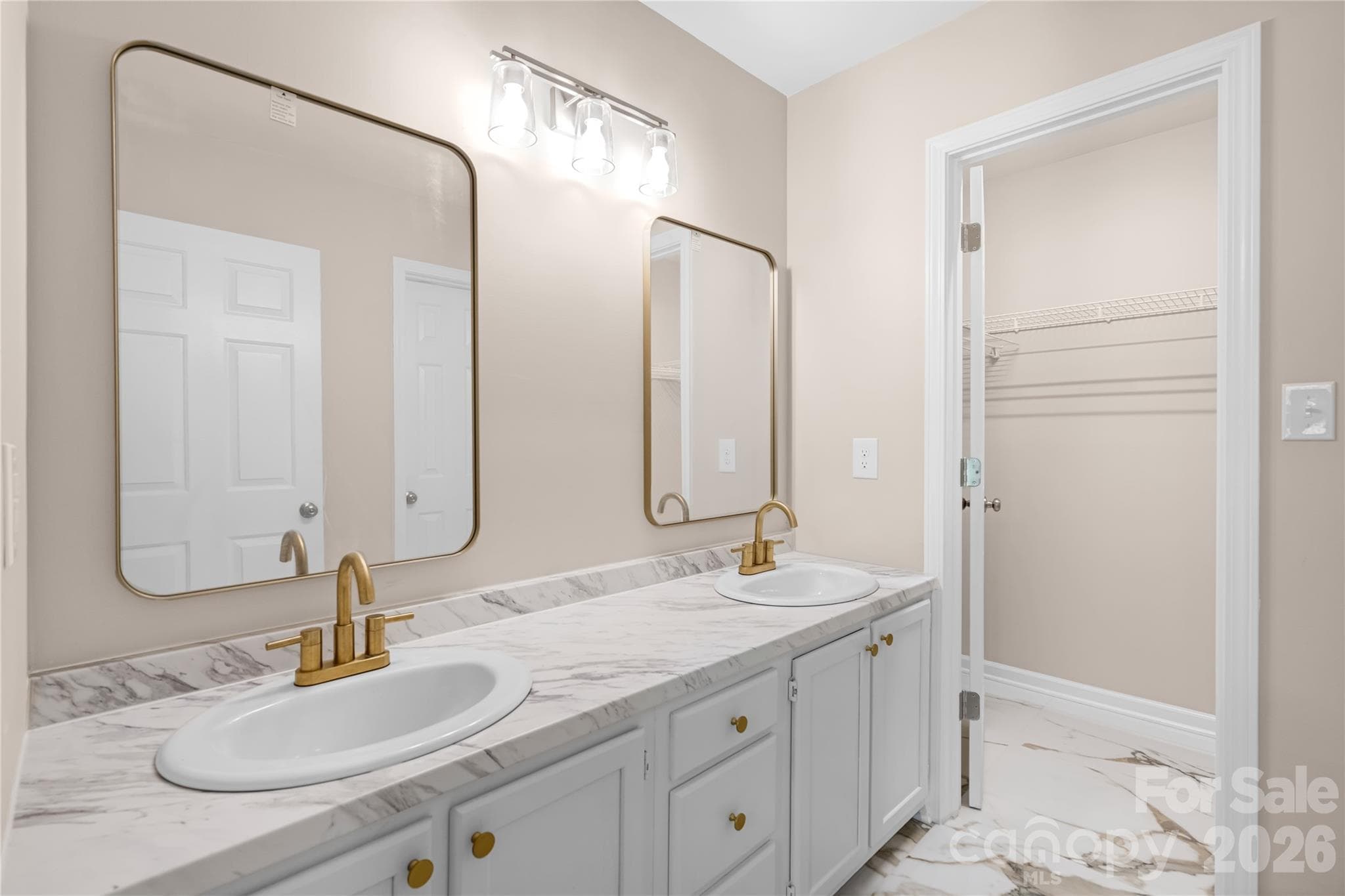 Master BathroomCalacatta floor, and vanity top, Delta brand Faucets, brand new sinks, Delta Mirrors and Bathroom Light - 2065 Gary Lane, Hickory