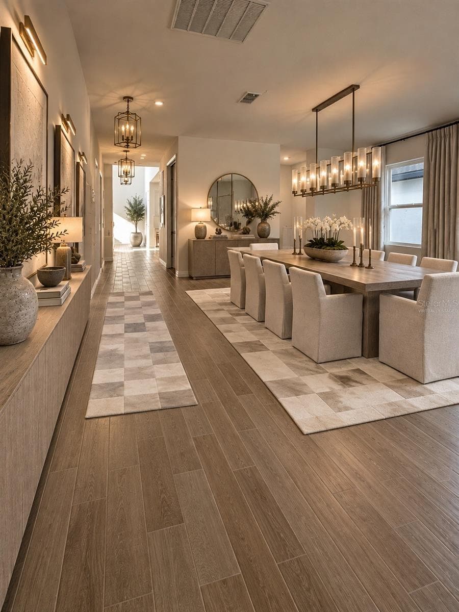 A Grand First Impression of Timeless Elegance! Step into an impressive, beautifully proportioned entryway that welcomes you with an exceptional sense of space, warmth, and sophistication. This inviting foyer offers a graceful transition into the home’s expansive living areas, creating the perfect balance of architectural elegance, comfort, and refined luxury. A stunning introduction to a residence designed to feel like an exquisite model home.AI Virtual Staging Disclosure: This image has been virtually staged using artificial intelligence based on an original photograph of the actual property. Furniture, lighting, decorative finishes, and accessories are digitally generated for illustrative purposes only and are not included with the rental property. - 5714 CATTLE RANCH DR, ST CLOUD